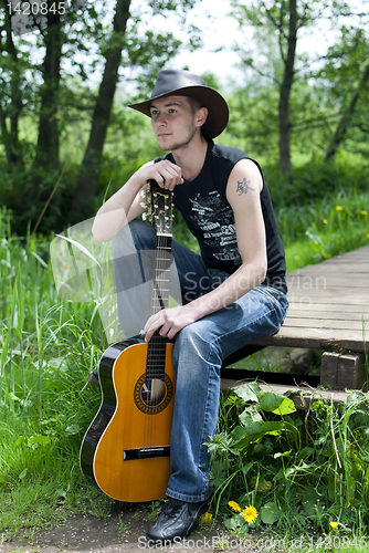 Image of man with a guitar 