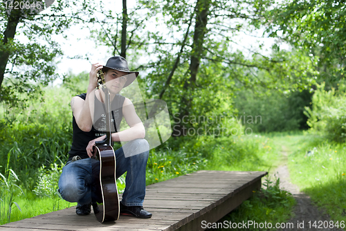 Image of man with a guitar 