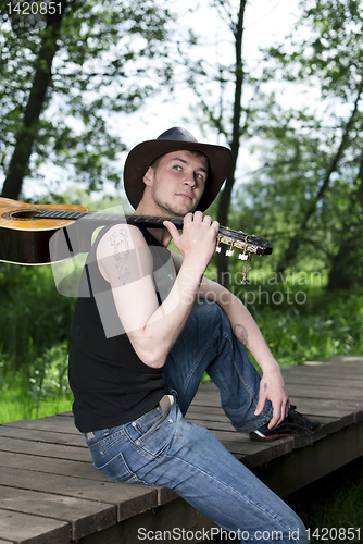 Image of man with a guitar 