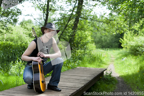 Image of man with a guitar 