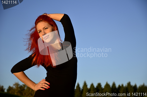 Image of Redhead girl posing