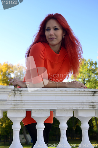 Image of Redhead girl standing at the railing