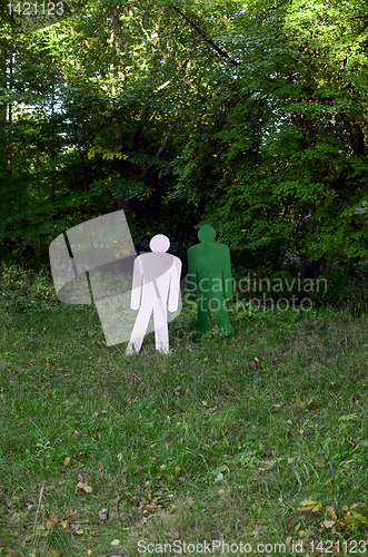 Image of two targets standing in the woods