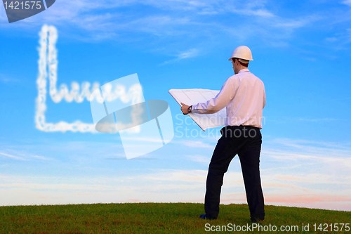 Image of Man with plan and factory