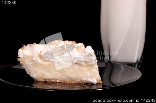 Image of Pineapple coconut cream pie with toasted coconut and milk