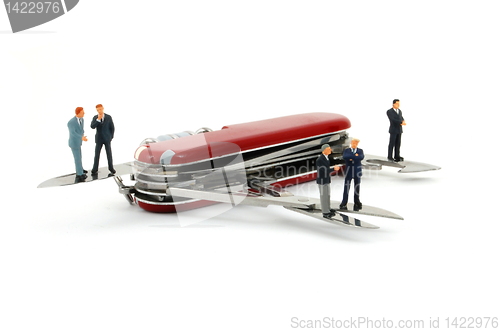 Image of business people on penknife