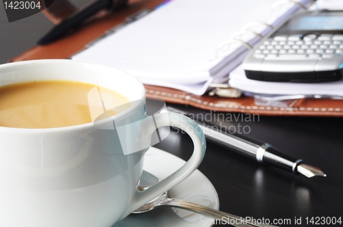 Image of cup of coffee in the office