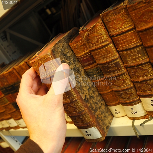 Image of old books in a library