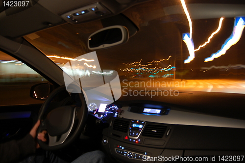 Image of car in motion at night