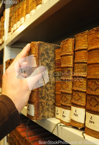 Image of old books in a library