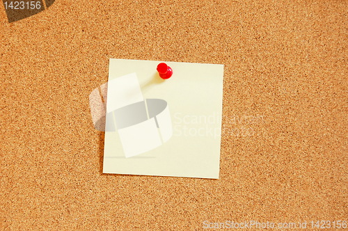 Image of empty sheet paper with push pin