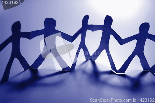 Image of teamwork of paper team
