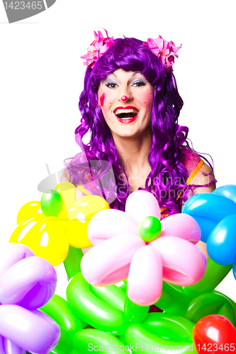 Image of female clown with colorful balloon flowers