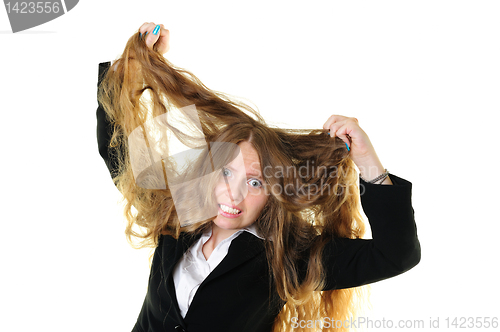 Image of Businesswoman tearing her hair