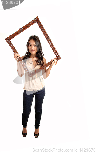 Image of Girl holding picture frame.