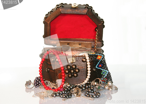 Image of wooden  small box with jewelry 