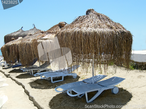 Image of  umbrella, beach chair 