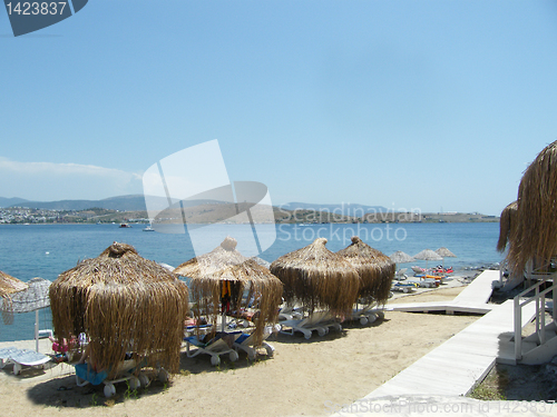 Image of umbrella, beach chair