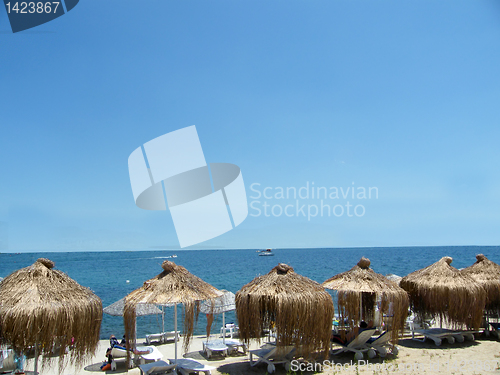 Image of umbrella, beach chair