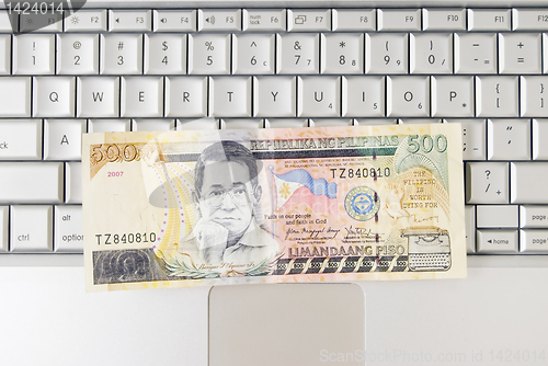 Image of Money on Computer Keyboard