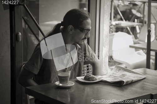 Image of Young man in cafe