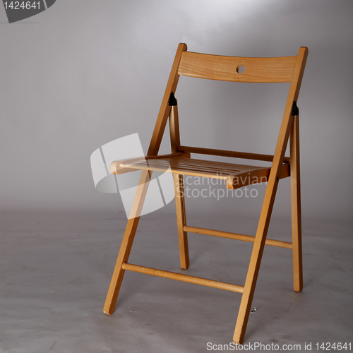 Image of A wood foldable chair