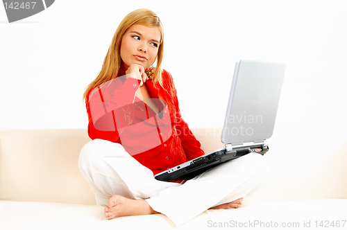 Image of Women with laptop on couch