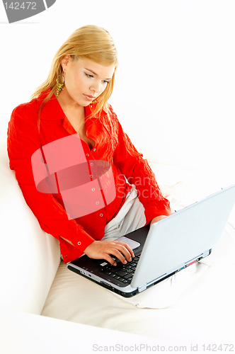 Image of Women with laptop on couch