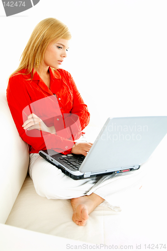 Image of Women with laptop on couch