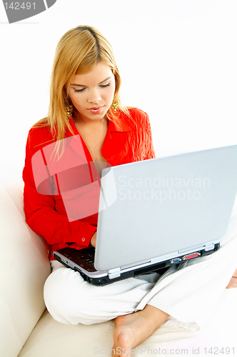 Image of Women with laptop on couch