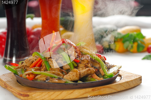 Image of original fajita sizzling hot  on iron plate