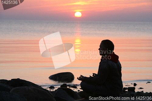 Image of silhouette of sitting man