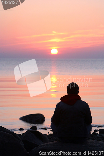 Image of silhouette of sitting man