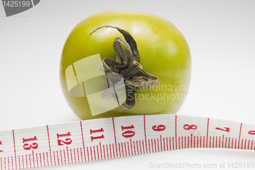 Image of Green Tomato and Tape Measure