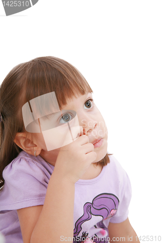 Image of Baby's scratching her nose. Little child scratching her nose.