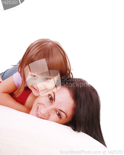 Image of Young Mother and daugther embracing on bed 