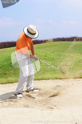 Image of Tourist in sand trap