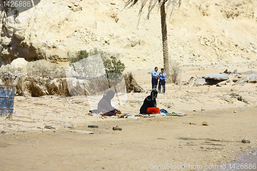 Image of Arabian women and police