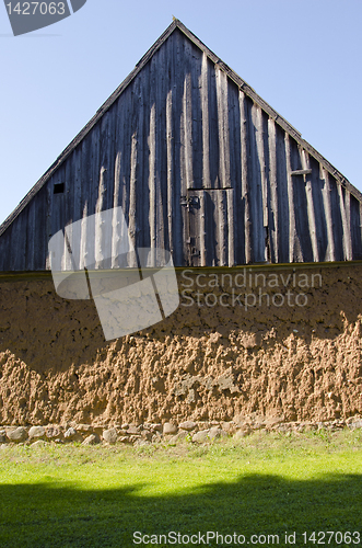 Image of Ancient house with mole walls and wooden roof.