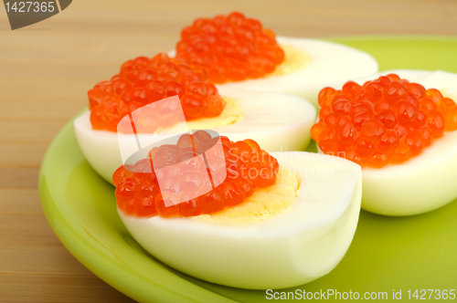 Image of red caviar on chicken egg