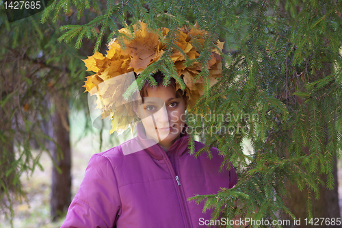 Image of Girl In Wreath Of oranga and yellow Leaves