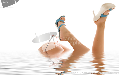 Image of high heels in water