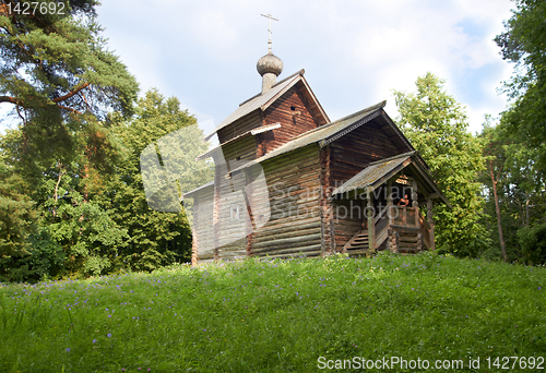 Image of aging wooden chapel in village