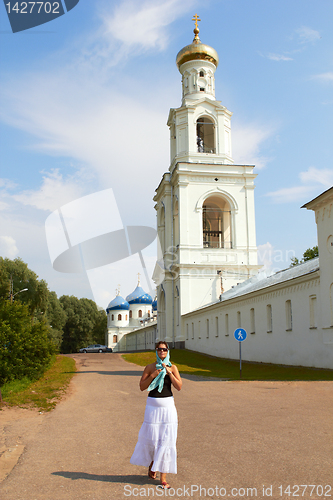 Image of Woman in field on castle background