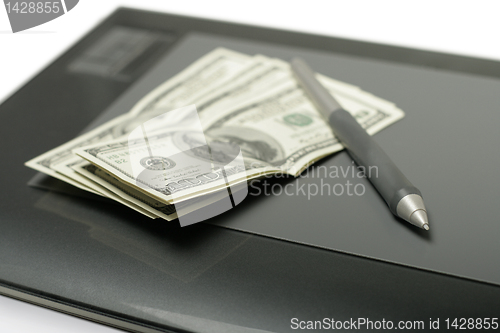 Image of Graphic tablet with pen and money
