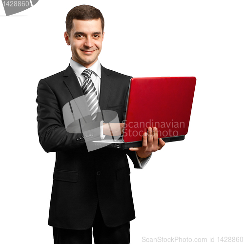Image of male in suit with laptop in his hands