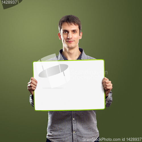 Image of male with write board in his hands