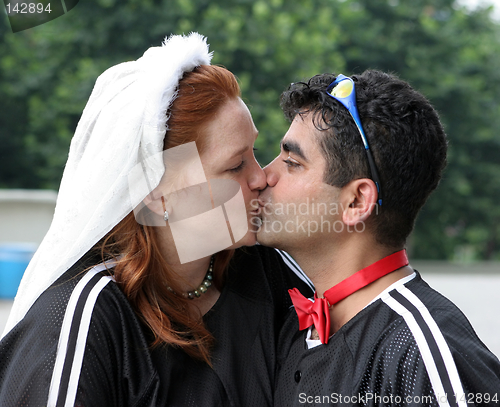 Image of Wedding day kiss