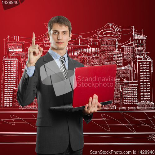 Image of male in suit with laptop with idea