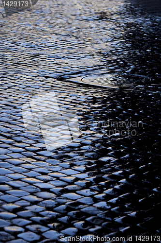 Image of Cobbled street after rain